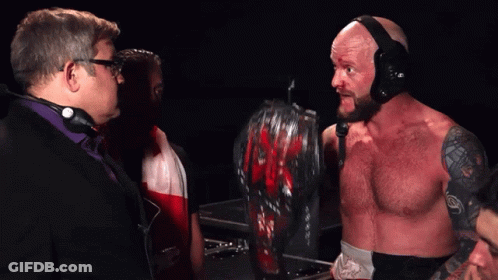 A Man In A Wrestling Ring With The Words I 'M The King Of The Mountain Around Here Below Him GIF