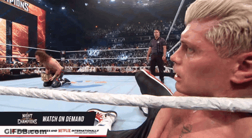 A Man In A Wrestling Ring With The Words Night Of The Champions On It GIF