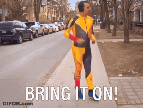 A Man In A Yellow And Blue Suit Is Running Down A Sidewalk With The Words Bring It On GIF