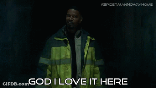 A Man In A Yellow And Gray Jacket Says " God I Love It Here " GIF