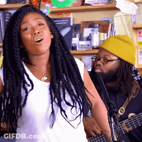 Man In Yellow Hat Playing Guitar Dreadlocks Woman GIF