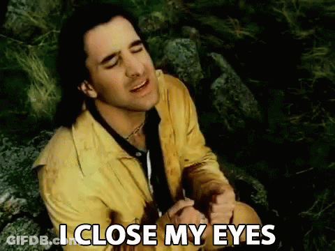 A Man In A Yellow Jacket And Tie Is Sitting On A Rock And Says I Close My Eyes GIF