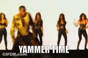 A Man In A Yellow Jacket Is Surrounded By Women Dancing And The Words Yammer Time Are Visible GIF
