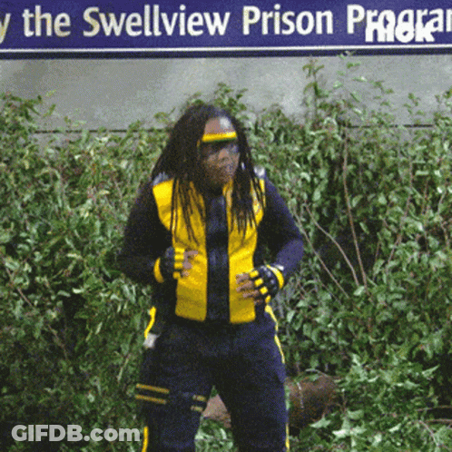 A Man In A Yellow Jacket Stands In Front Of A Sign That Says The Swellview Prison Program GIF