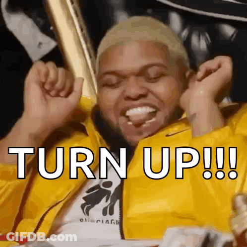 A Man In A Yellow Jacket With The Words Turn Up Written On His Face GIF