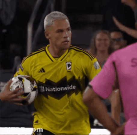 A Man In A Yellow Jersey That Says Nationwide GIF