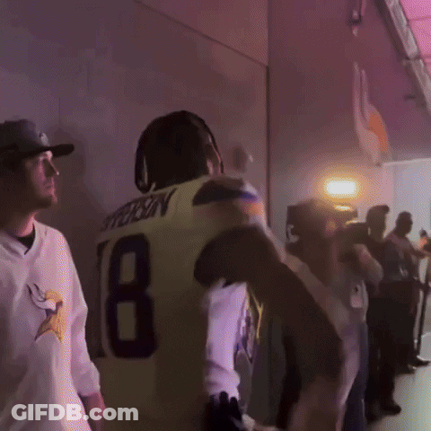 A Man In A Yellow Jersey With The Number 18 On The Back GIF