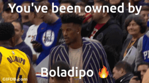 A Man In A Yellow Jersey With The Number 4 Stands In The Crowd GIF