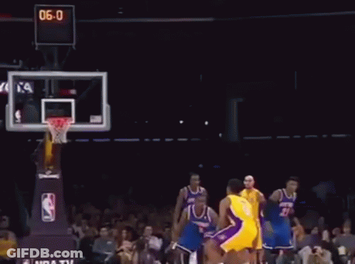 A Man In A Yellow Lakers Jersey Throws A Basketball GIF