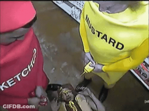 A Man In A Yellow Mustard Costume Holds A Mustard Bottle GIF