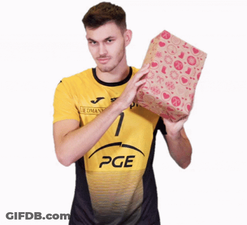 A Man In A Yellow Pge Shirt Holds A Gift GIF