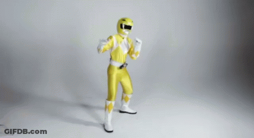 A Man In A Yellow Power Ranger Costume Is Dancing GIF
