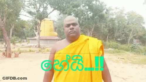 A Man In A Yellow Robe Is Standing In Front Of A Sign That Says " !! " GIF