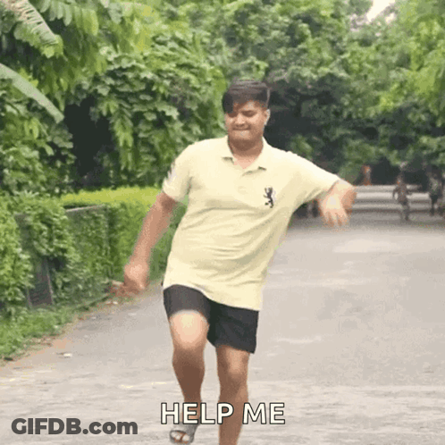 A Man In A Yellow Shirt And Black Shorts Is Running Down A Road And Asking For Help . GIF