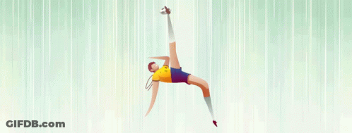 A Man In A Yellow Shirt And Blue Shorts Is Jumping In The Air GIF