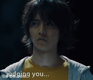 A Man In A Yellow Shirt Is Being Judged By Someone GIF