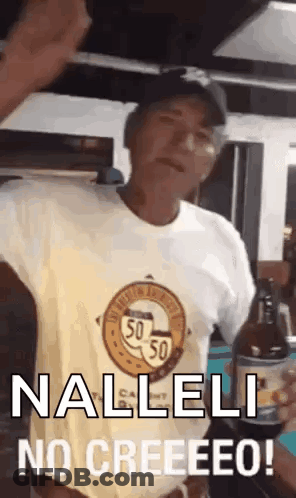 A Man In A Yellow Shirt Is Holding A Bottle Of Beer And Saying Nalleli No Creeeeeo . GIF