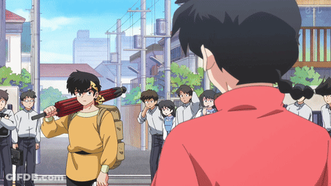 A Man In A Yellow Shirt Is Holding A Red Umbrella GIF
