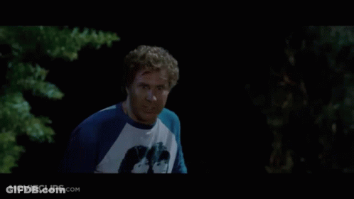 A Man In A Yellow Shirt Is Laying In The Dirt With Movieclips.com Written On The Bottom GIF