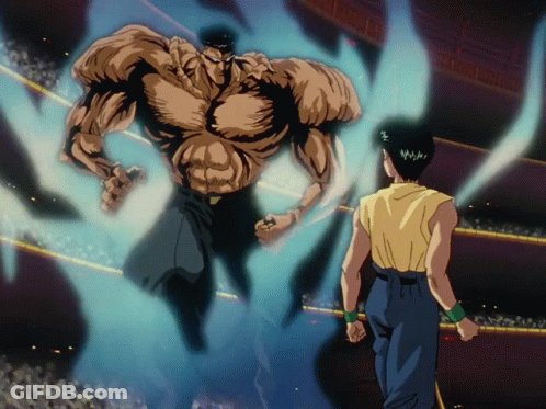 A Man In A Yellow Shirt Is Standing In Front Of A Giant Muscular Man GIF
