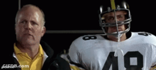 A Man In A Yellow Shirt Is Standing Next To A Football Player With The Number 19 On His Jersey GIF