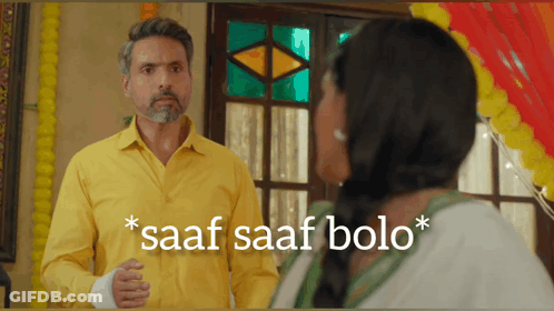 A Man In A Yellow Shirt Is Standing Next To A Woman With The Words Saaf Saaf Bolo On The Bottom GIF