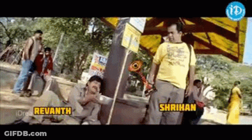 A Man In A Yellow Shirt Is Standing Next To Another Man In A Yellow Shirt With The Words Revanth And Shrihan On The Bott GIF