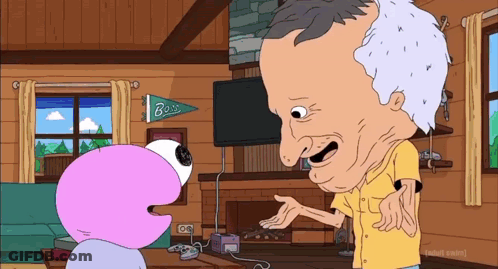 A Man In A Yellow Shirt Is Talking To A Pink Cartoon Character In A Living Room GIF