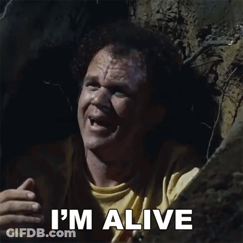 A Man In A Yellow Shirt Says I 'M Alive In A Cave GIF