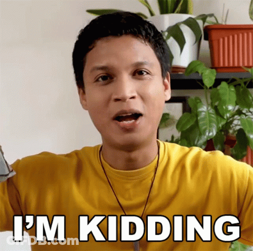 A Man In A Yellow Shirt Says I 'M Kidding In White Letters GIF