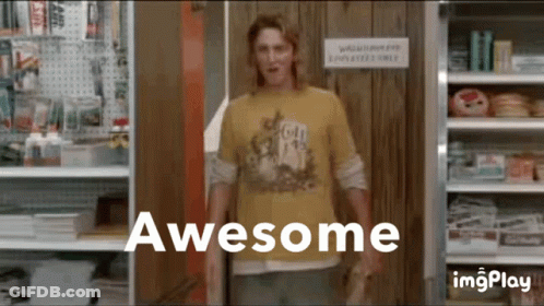 A Man In A Yellow Shirt Standing In Front Of A Sign That Says Awesome GIF