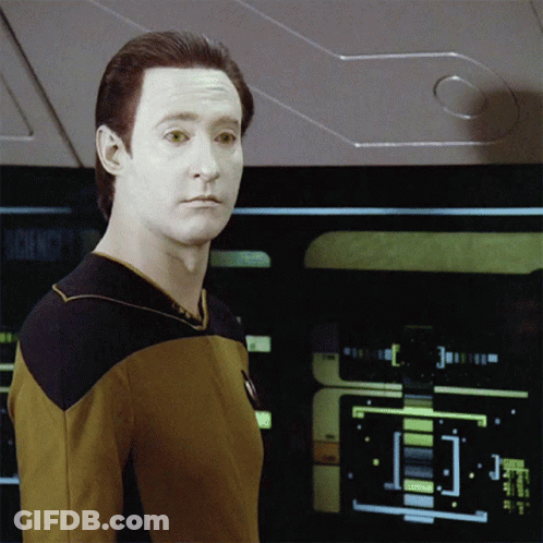 A Man In A Yellow Shirt Stands In Front Of A Screen That Says Science GIF