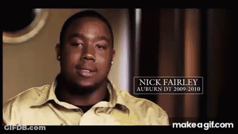 A Man In A Yellow Shirt With The Name Nick Fairley GIF
