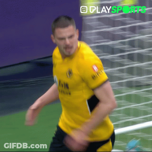 A Man In A Yellow Shirt With The Word Play Sports On The Bottom Right GIF