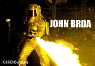 A Man In A Yellow Suit Is Holding A Flamethrower With The Name John Brd Written Above Him GIF