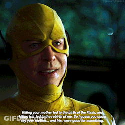 A Man In A Yellow Superhero Costume Is Talking About His Mother And Iris GIF
