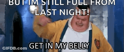 A Man In A Yellow Sweater And Suspenders Is Making A Funny Face With The Words But Im Still Full From Last Night GIF
