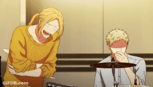 A Man In A Yellow Sweater Is Laughing Next To Another Man In A White Shirt GIF