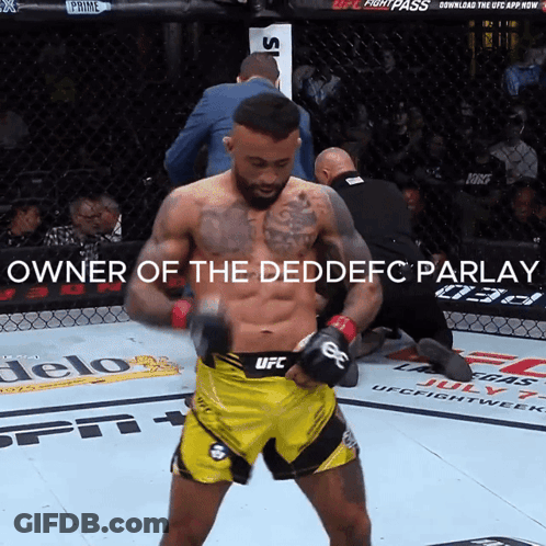 A Man In A Yellow UFC Shorts Stands In A Boxing Ring GIF