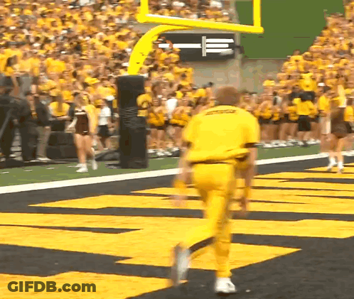 A Man In A Yellow Uniform That Says Ucsd On It GIF