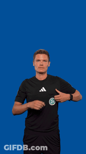 A Man In An Adidas Shirt Is Holding A Yellow Card GIF