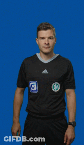 A Man In An Adidas Shirt Is Holding Up A Red Card GIF