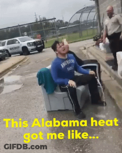 A Man In An American Eagle Shirt Is Sitting On A Couch In The Rain GIF