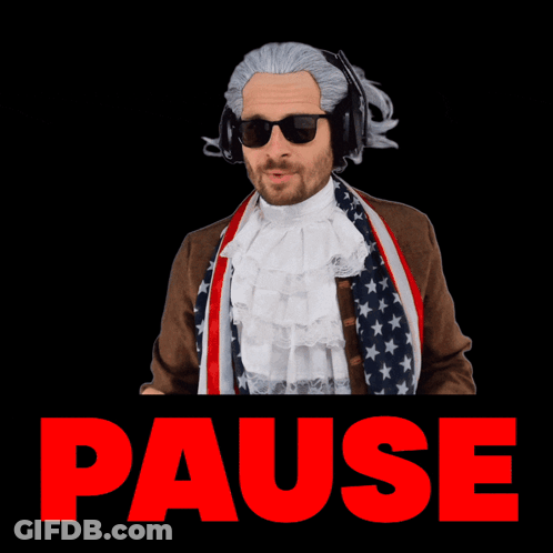 A Man In An American Flag Costume Is Making A Pause Gesture With His Hands GIF