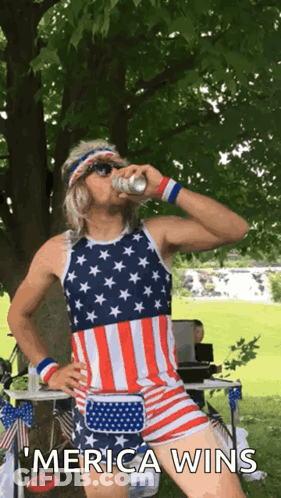 A Man In An American Flag Outfit Drinks From A Can And Says " Merica Wins " GIF