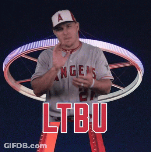 A Man In An Angels Jersey Stands In Front Of A Ferris Wheel And Says Ltbu GIF