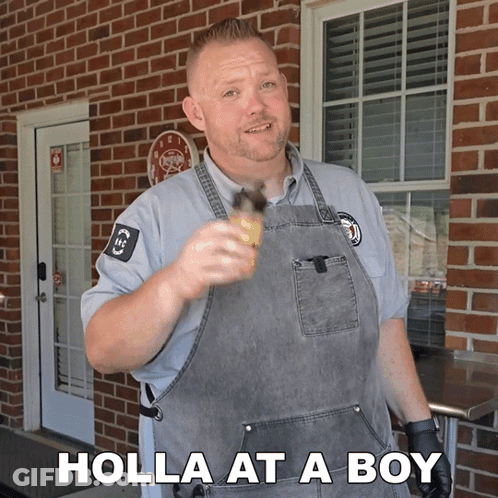 A Man In An Apron Is Holding A Bottle And The Words Holla At A Boy Are Below Him GIF