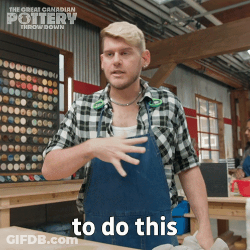 A Man In An Apron Says To Do This In Front Of A Sign For The Great Canadian Pottery Throw Down GIF