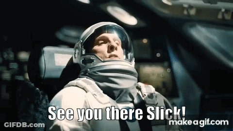 A Man In An Astronaut 'S Helmet Is Sitting In A Car And Says `` See You There Slick '' . GIF