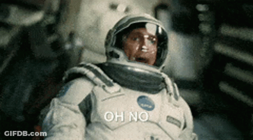 A Man In An Astronaut 'S Suit Is Saying Oh No GIF